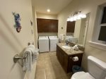 Full bathroom on the first level with washer and dryer 